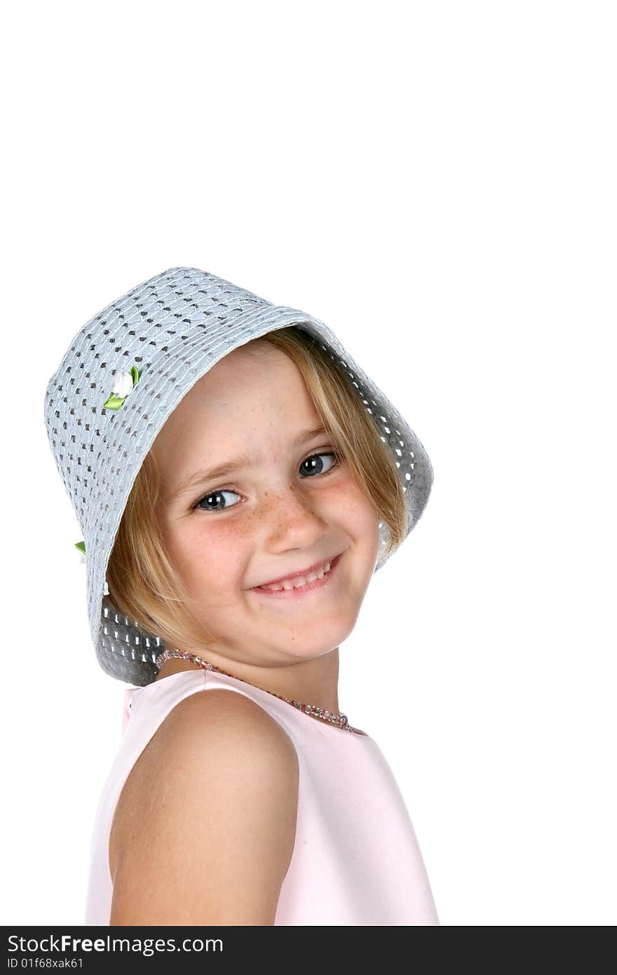 Cute young girl wearing blue hat and smiling