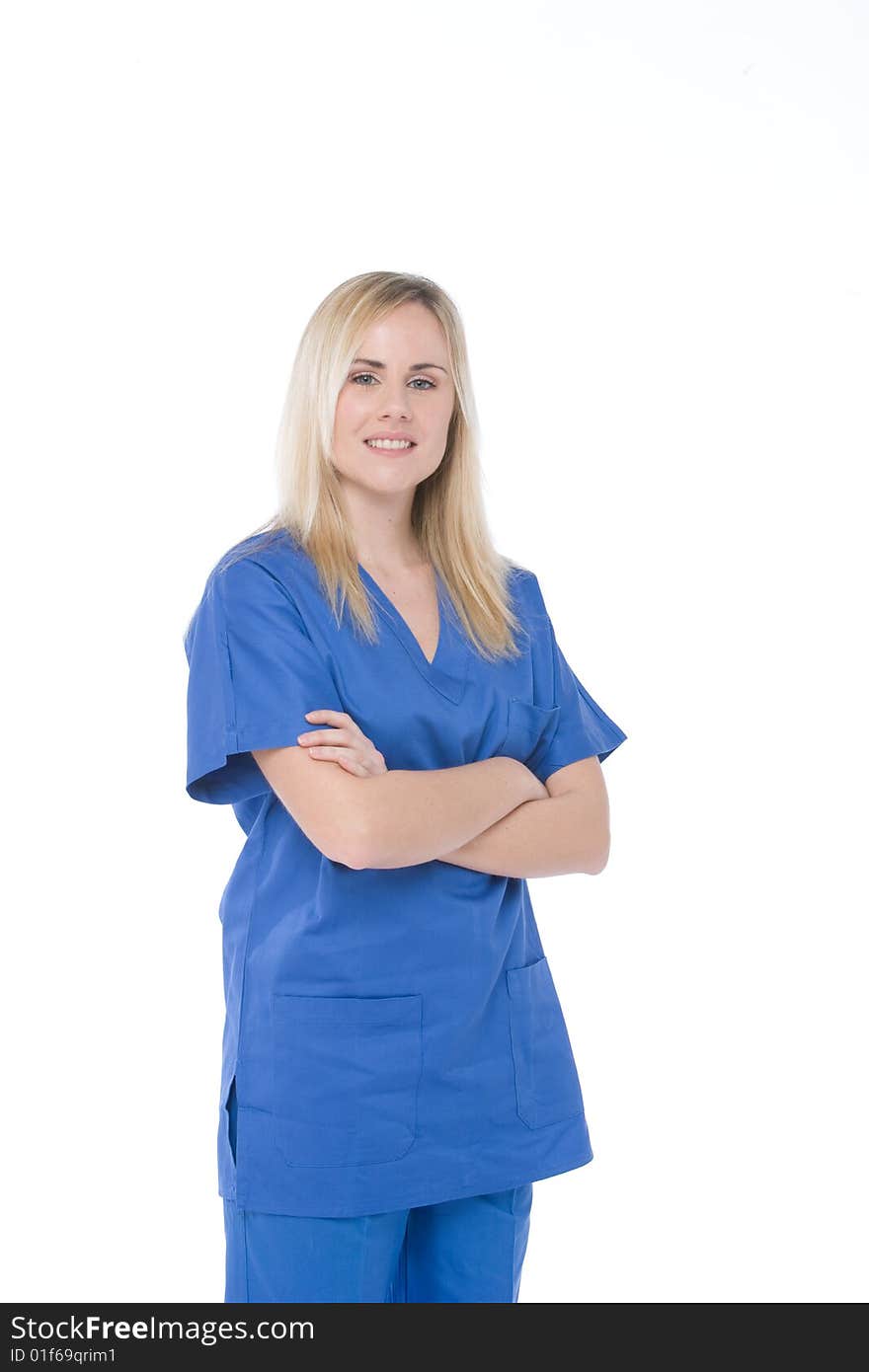 Studio shot of a nurse isolated on white with crossed arms. Studio shot of a nurse isolated on white with crossed arms