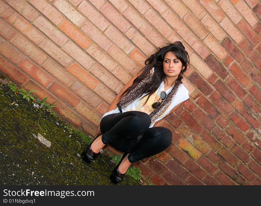 A beautiful young Asian woman looking lost in a western city. A beautiful young Asian woman looking lost in a western city.