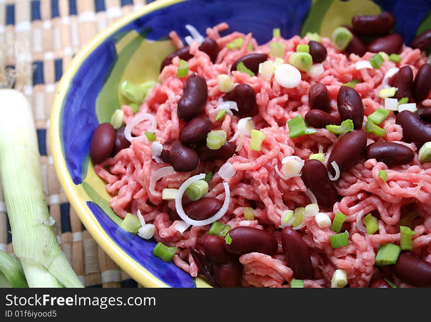 Some fresh mat with beans and onions. Some fresh mat with beans and onions