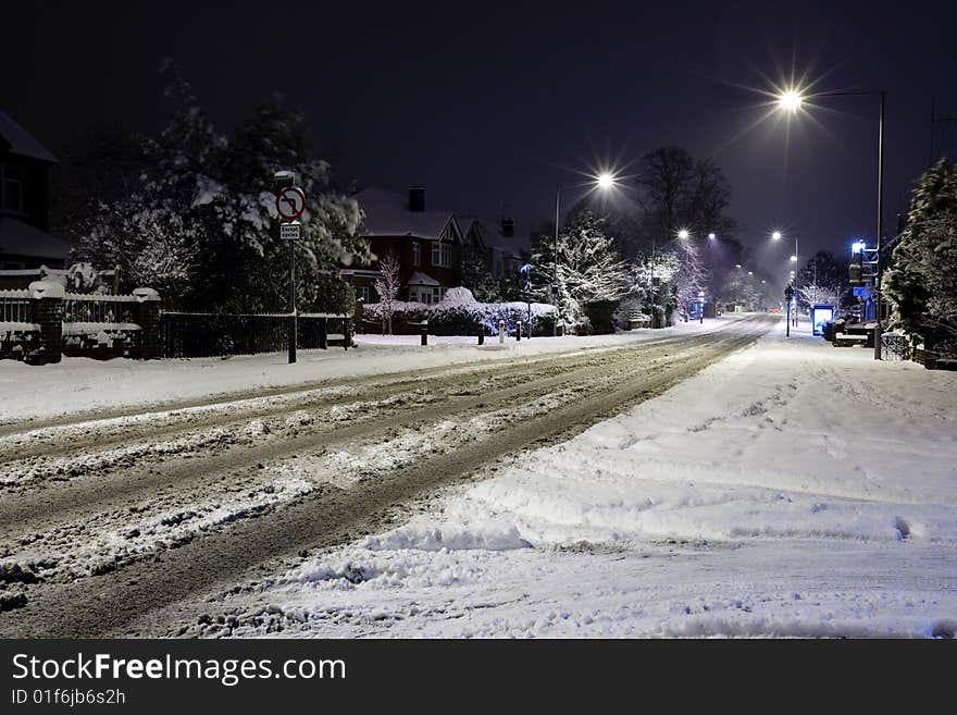 Early Morning Urban Snow with street lamps