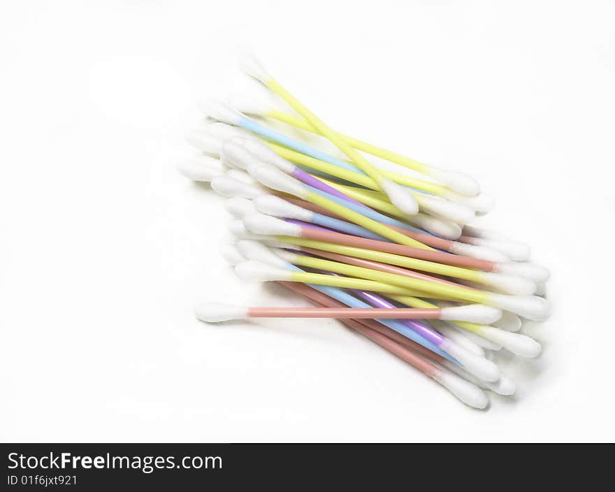 Pile of coton buds over a white background. Pile of coton buds over a white background