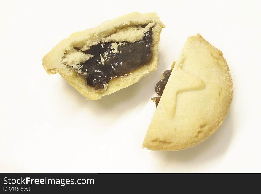 Mincepie cut in half isolated over a white background