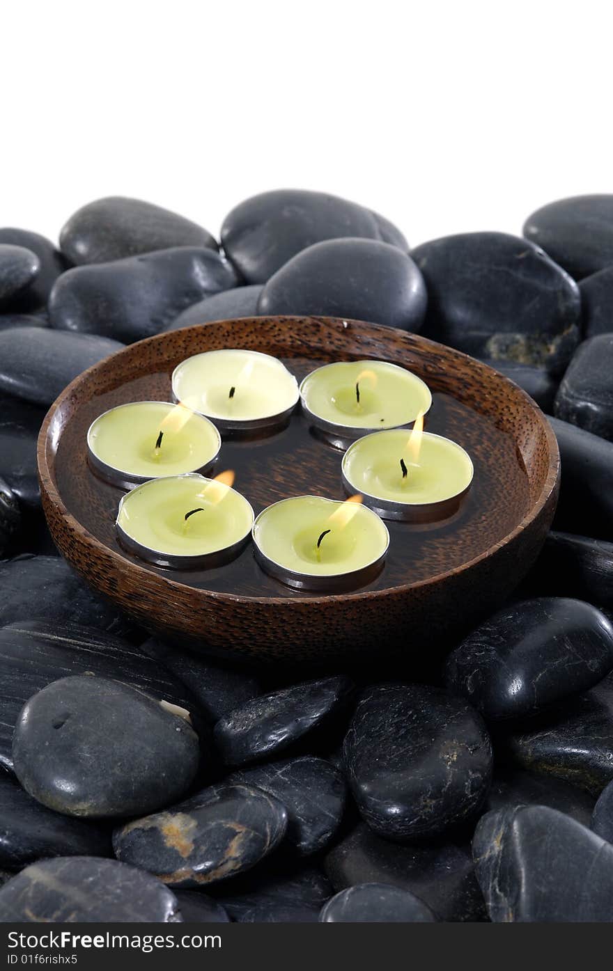 Aromatic candles and pebbles for spa session. Aromatic candles and pebbles for spa session