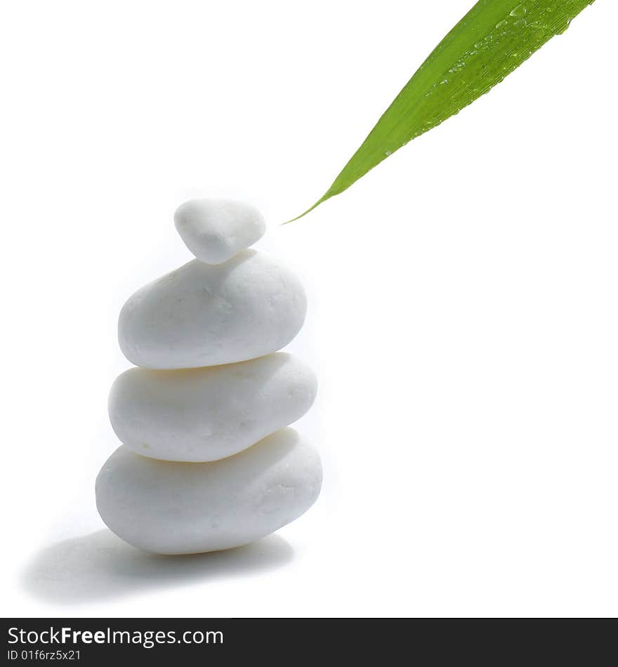 Bamboo leaf, and stones isolated on white