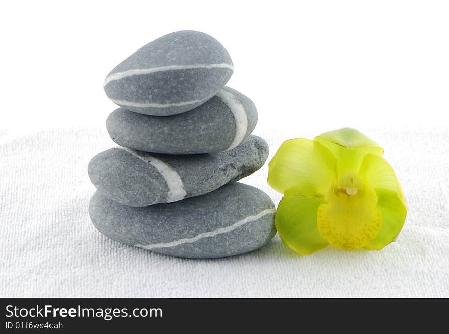 Stacked zen stones with orchid