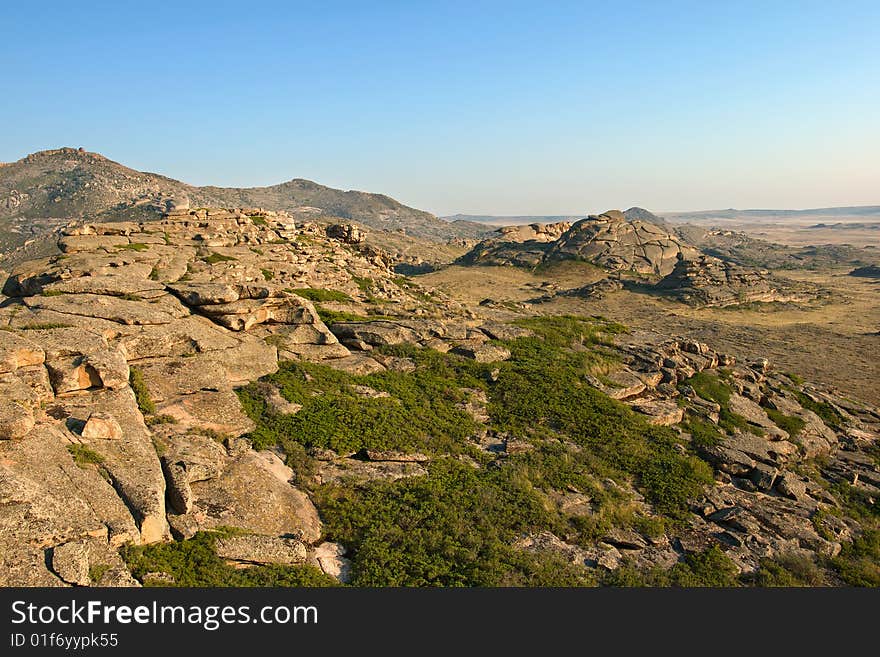 Mountain with rocks under blue sky. Mountain with rocks under blue sky