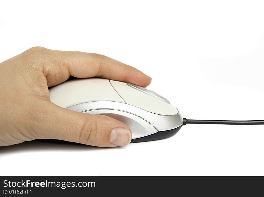 An image of a human hand holding a computer mouse