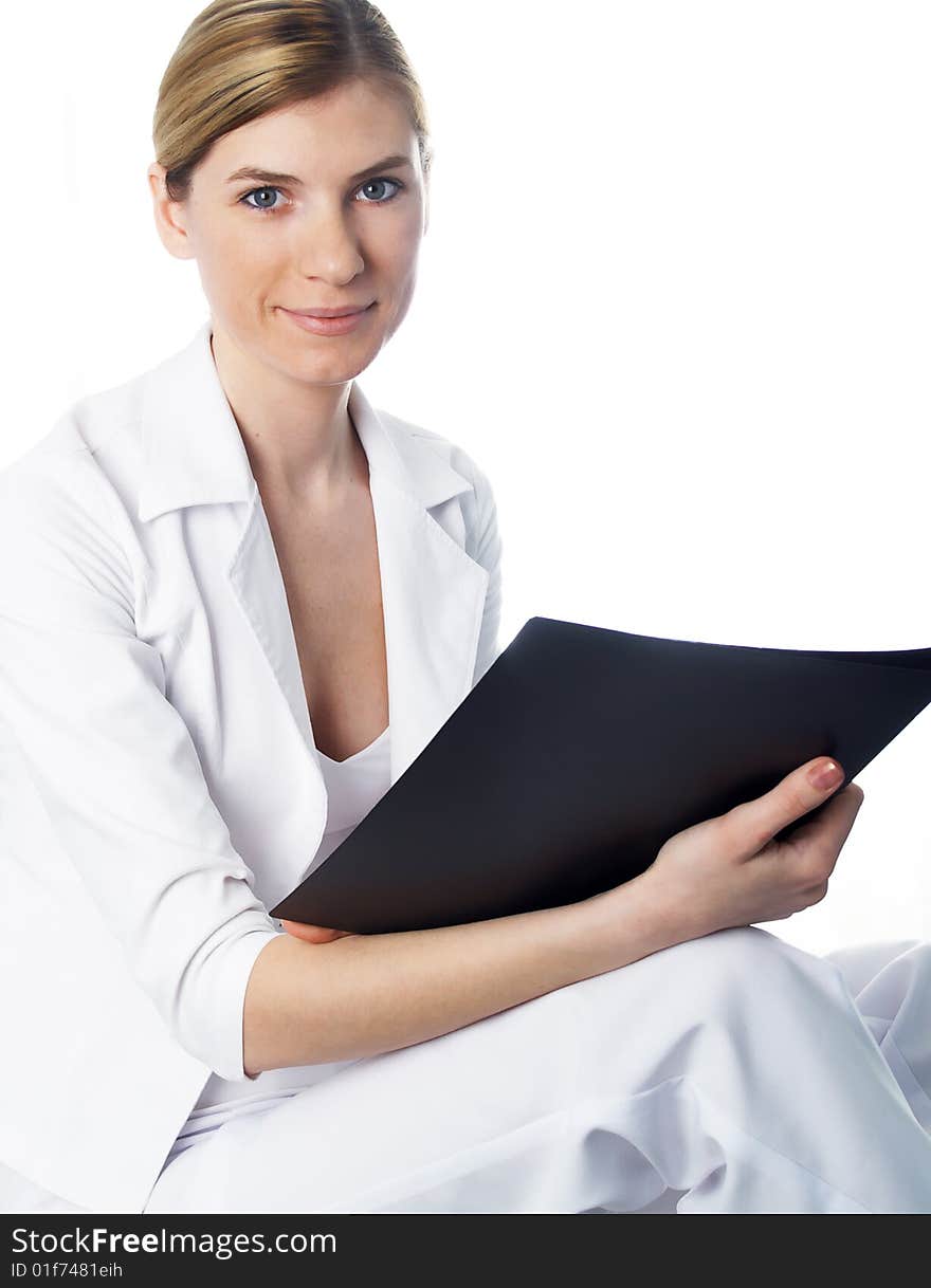 The beautiful businesswoman in a white jacket. The beautiful businesswoman in a white jacket