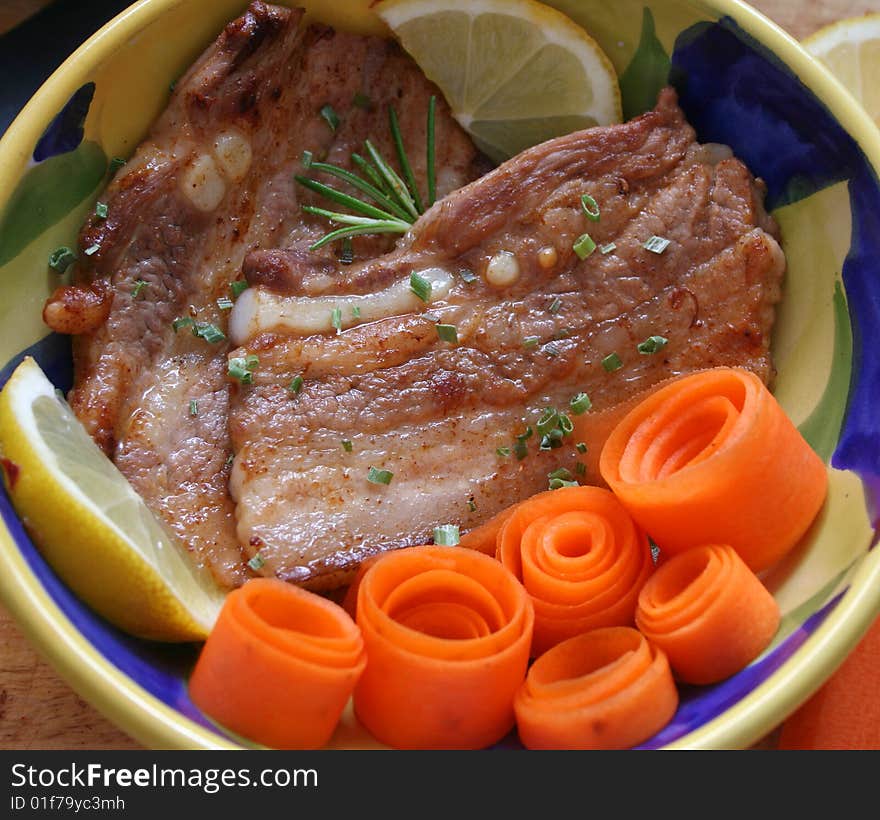 Fresh meat of pork with carrot-salad. Fresh meat of pork with carrot-salad