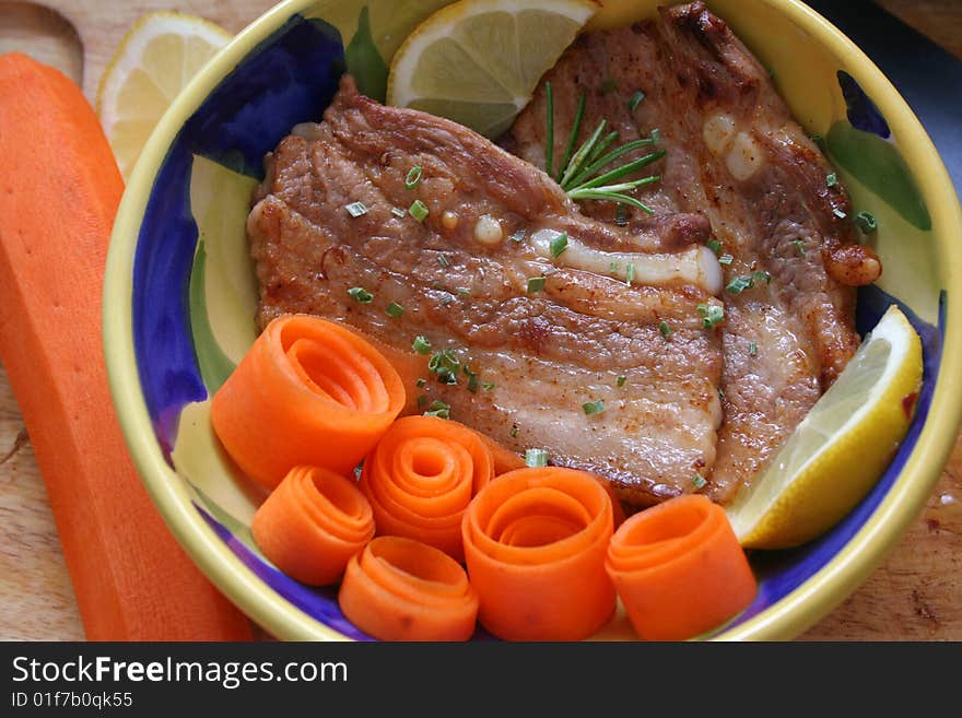 Fresh meat of pork with carrot-salad. Fresh meat of pork with carrot-salad