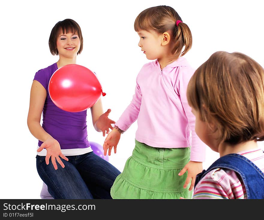 Mother and his two daughters with colorful balloons. studio shoot over white background