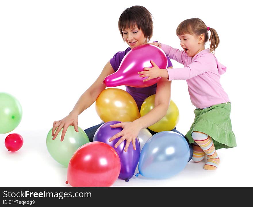 Mother and his daughter with colorful balloons. studio shoot over white background