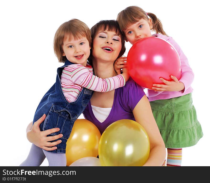 Mother and his two daughters with colorful balloons. studio shoot over white background