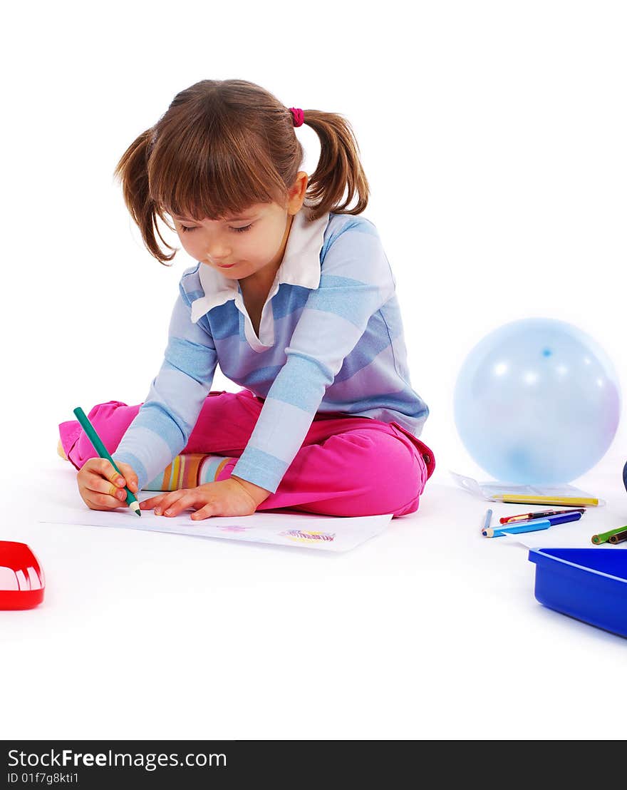 Young girl painting a picture on paper. Young girl painting a picture on paper