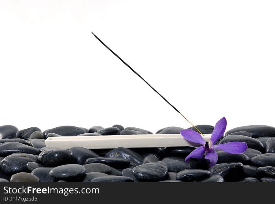 Stacked zen stones with flower. Stacked zen stones with flower