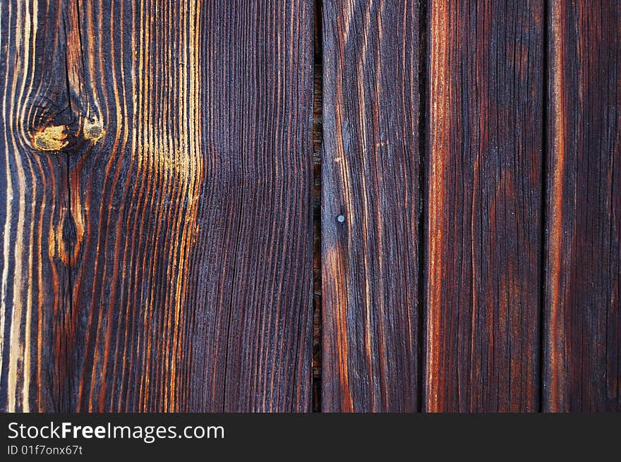 Old burnt wooden boarding texture. Old burnt wooden boarding texture