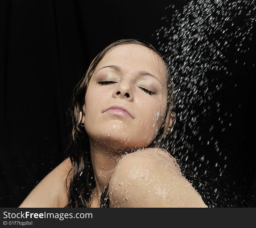 Beauty woman under shower in bath room