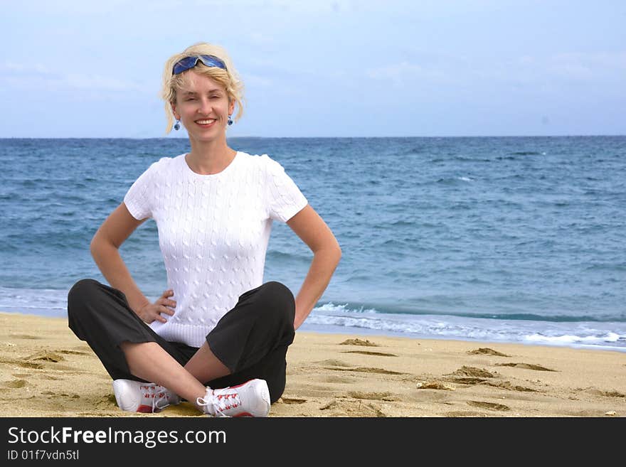 Girl Meditating By The Sea