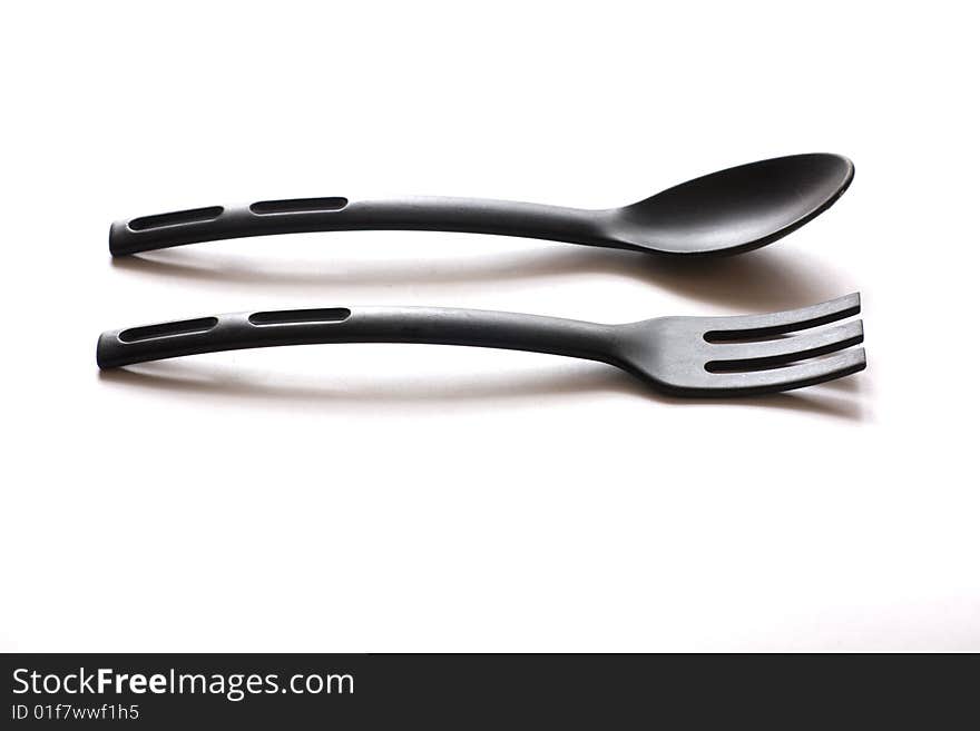 Spoon and fork for cookware coated with Teflon