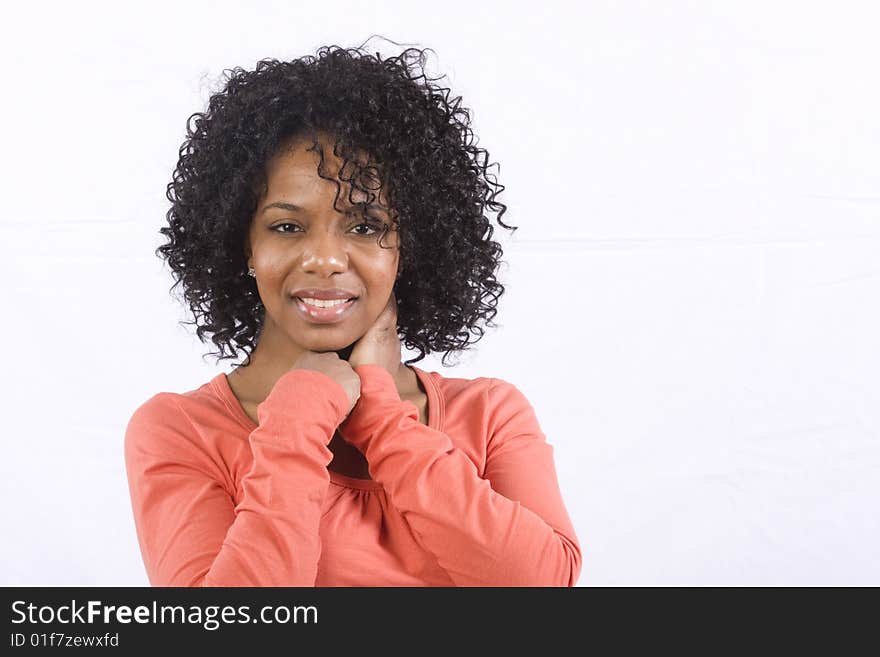 A friendly African American woman smiles at the camera. A friendly African American woman smiles at the camera