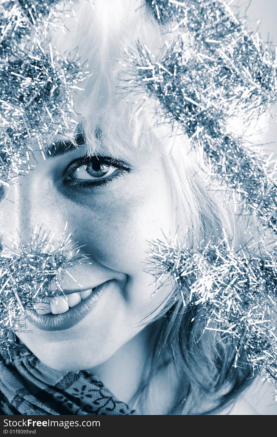 Winter portrait of a beautiful young smiling woman