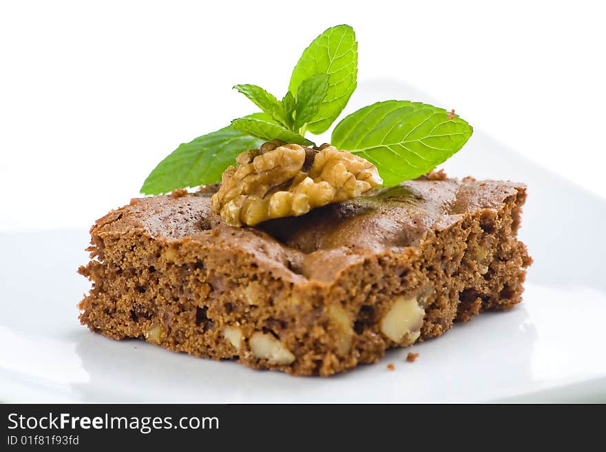 Hot chocolate brownie with walnuts and vanilla isolated