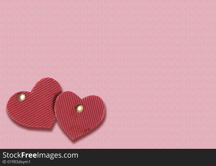 Two cardboard hearts of red color on a pink background. Two cardboard hearts of red color on a pink background.