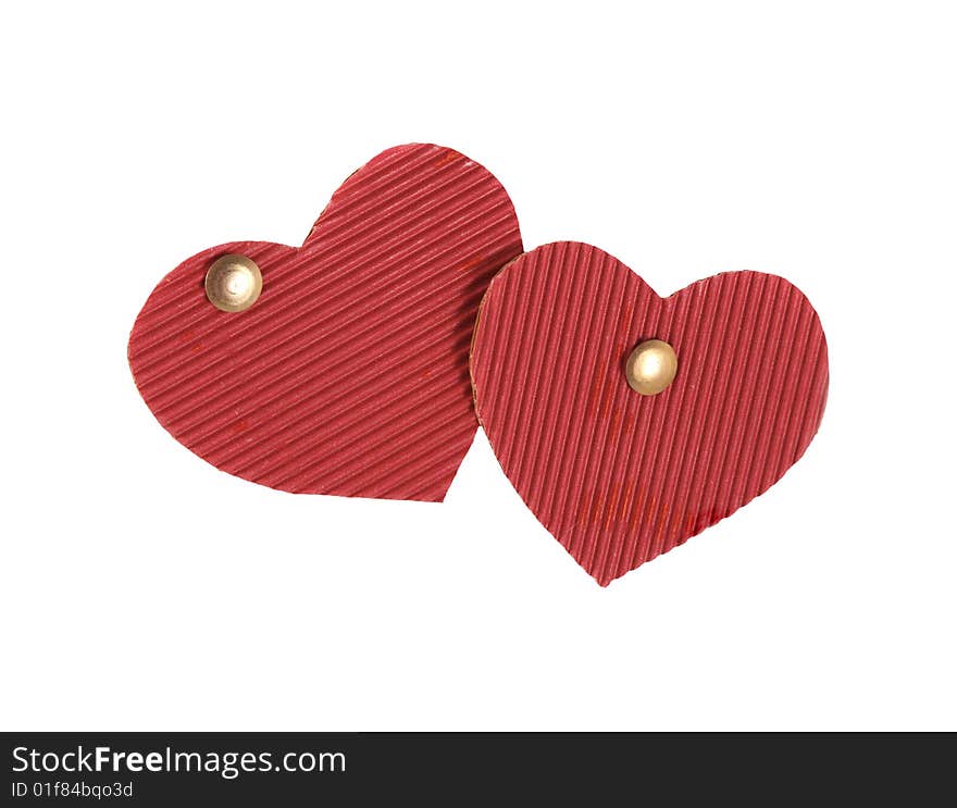 Two hearts of red color from a cardboard on white background.