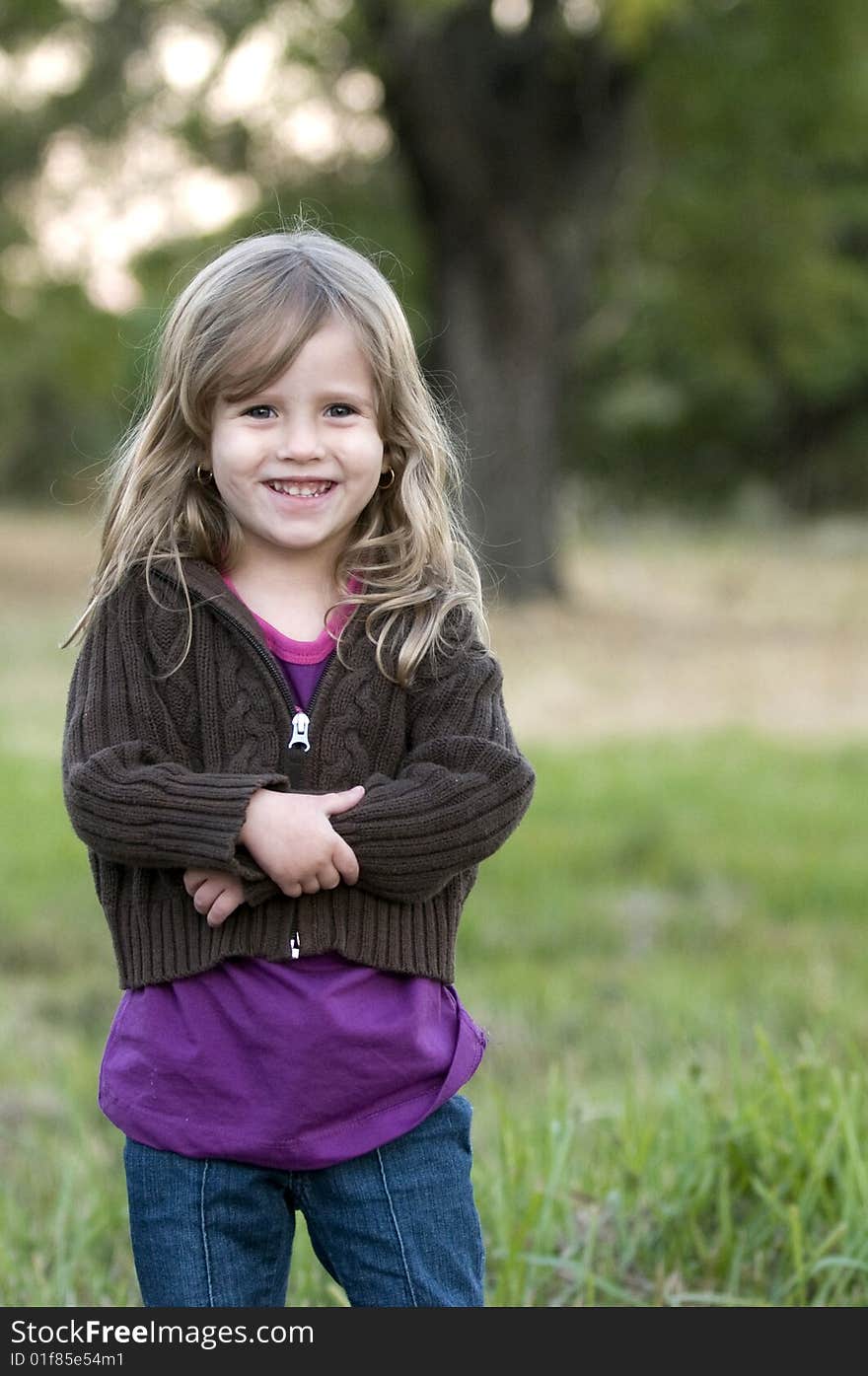 Innocent happy Girl posing at the camera