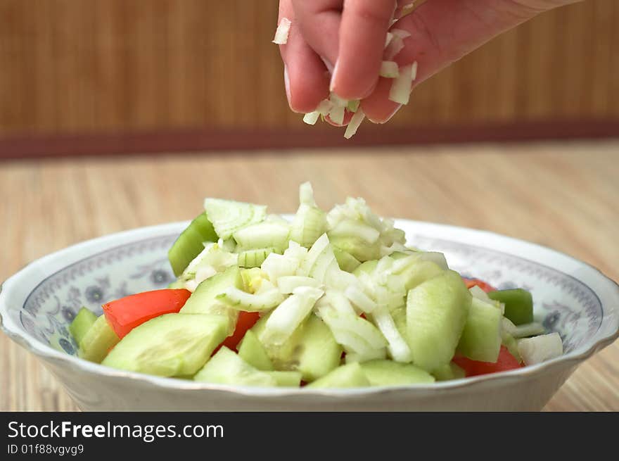 Preparing The Salad To The Dinner.