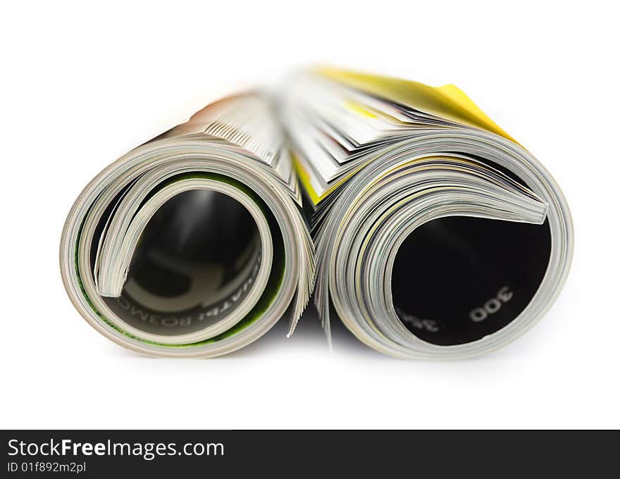 Rolled magazines isolated on white background