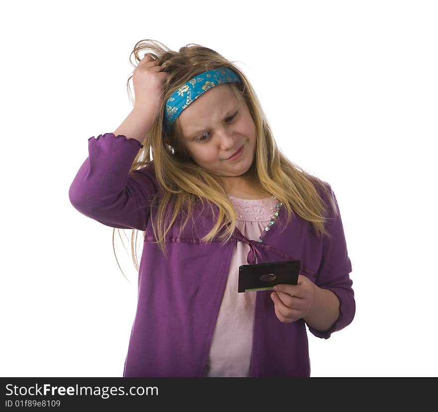 Young Girl Confused by Old Floppy Disc