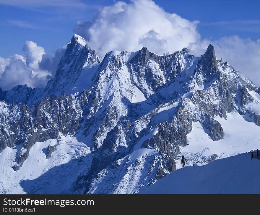 An impressive mountain landscape with snow ands clouds. An impressive mountain landscape with snow ands clouds