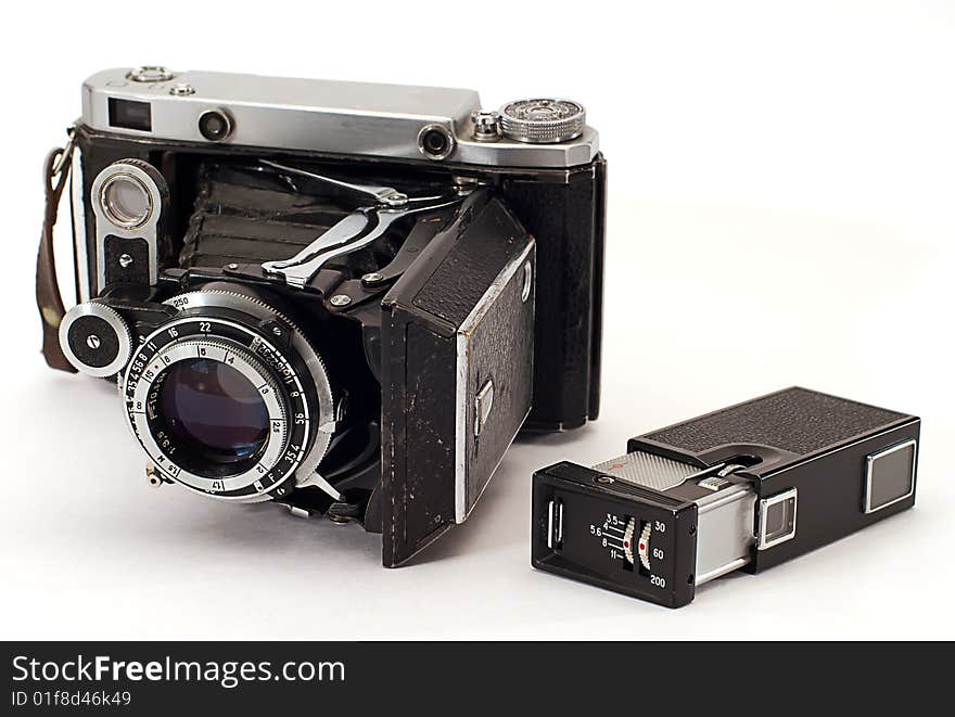 Two old photo cameras on white background