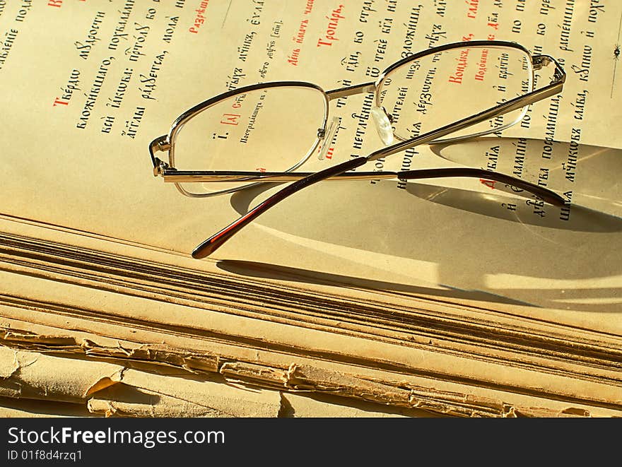 Old religious book and glasses. Old religious book and glasses