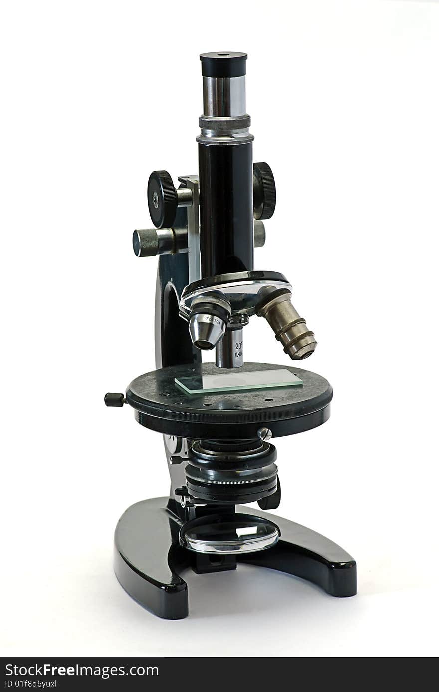 Old optical microscope isolated