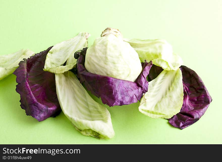 Cabbage close-up isolated on a green background