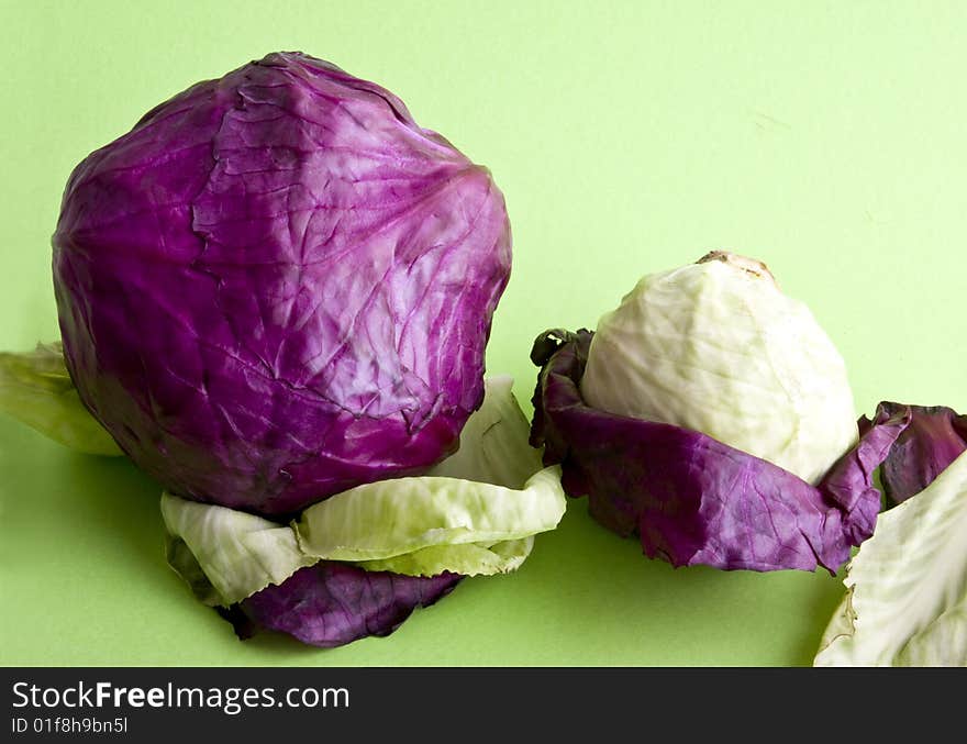 Cabbage close-up isolated on a green background