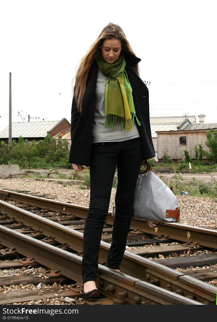 A girl travelling by railroad