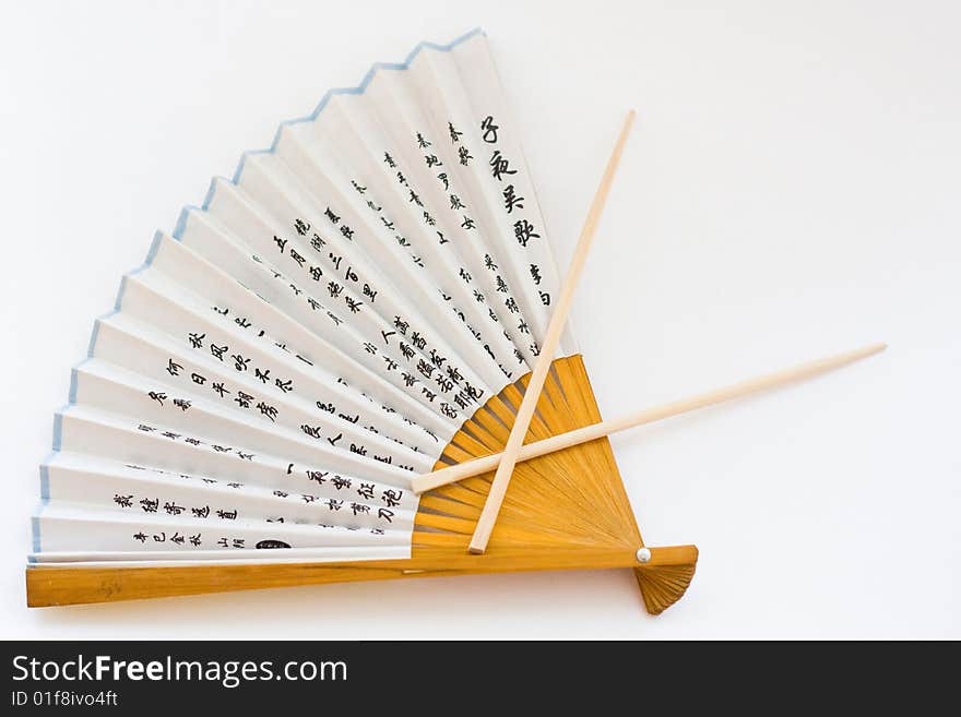 Fan and Chopsticks on the white background