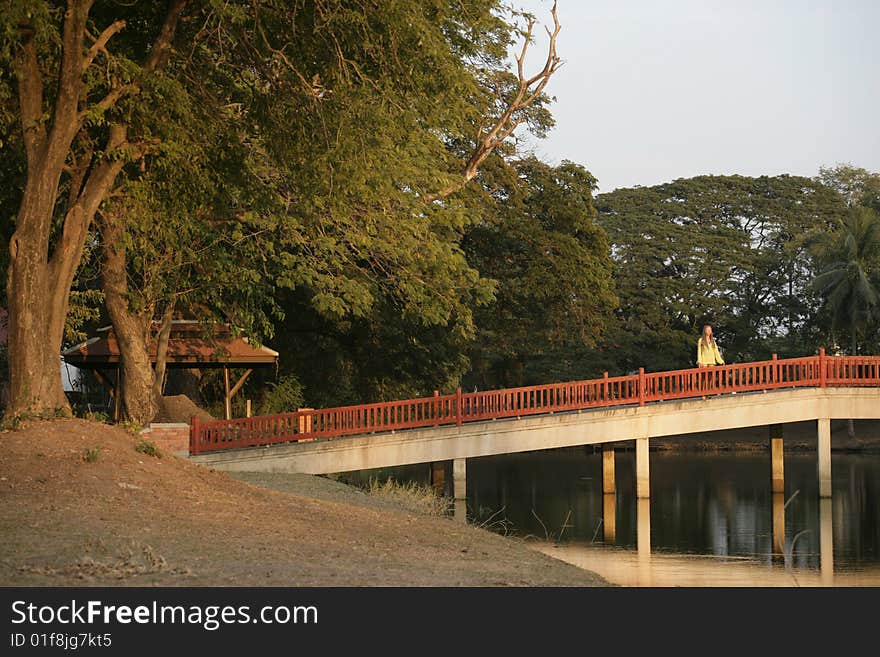 Girl in yellow on the bridge