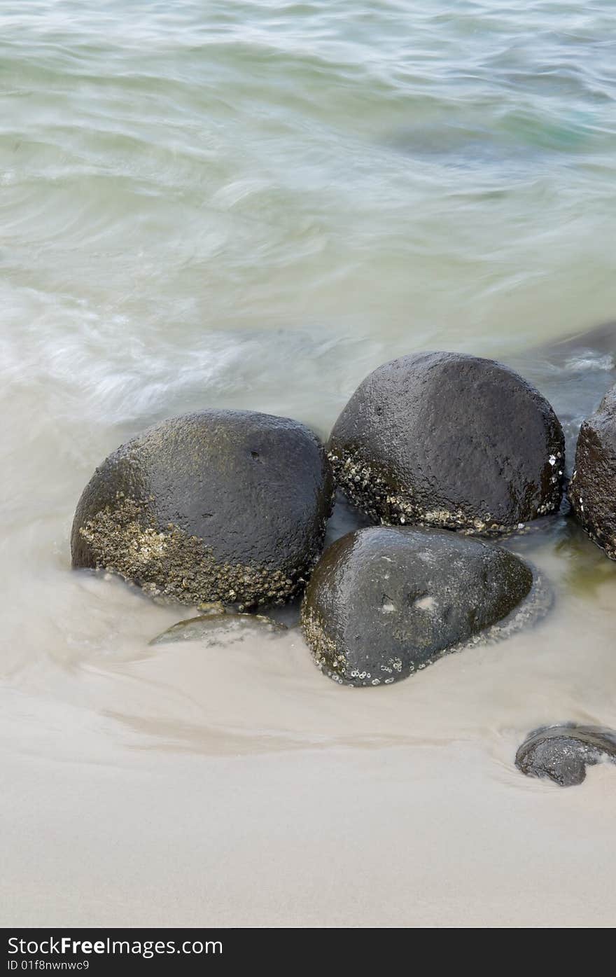 Rocks on a seashore exposed by the ebbing tide. Rocks on a seashore exposed by the ebbing tide.