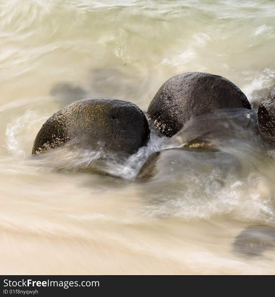 Sea Swirling Over Rocks