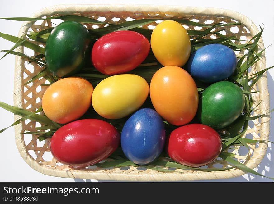 Easter eggs with different color on a basket