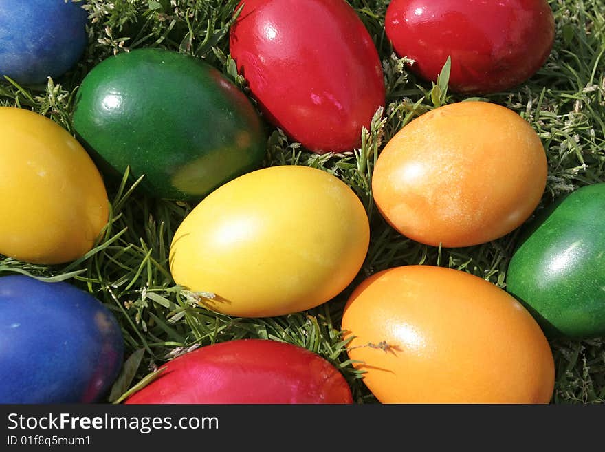 Easter eggs with different color on the grass