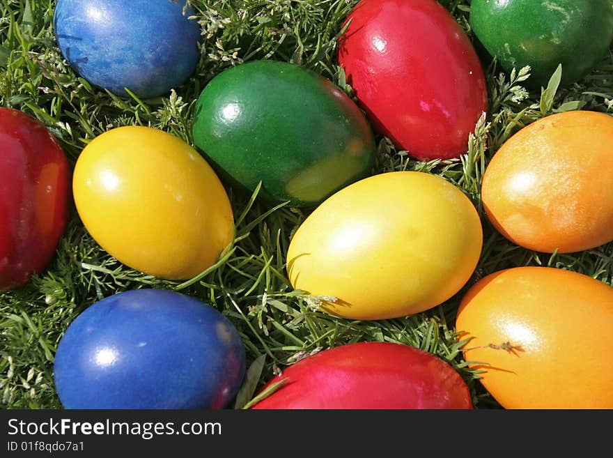 Easter eggs with different color on the grass