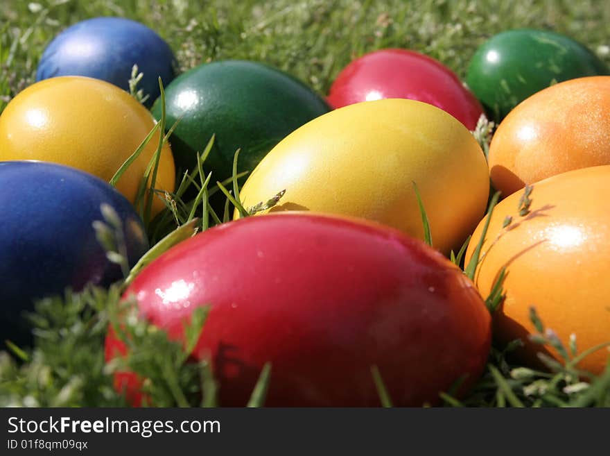 Easter eggs with different color on the grass