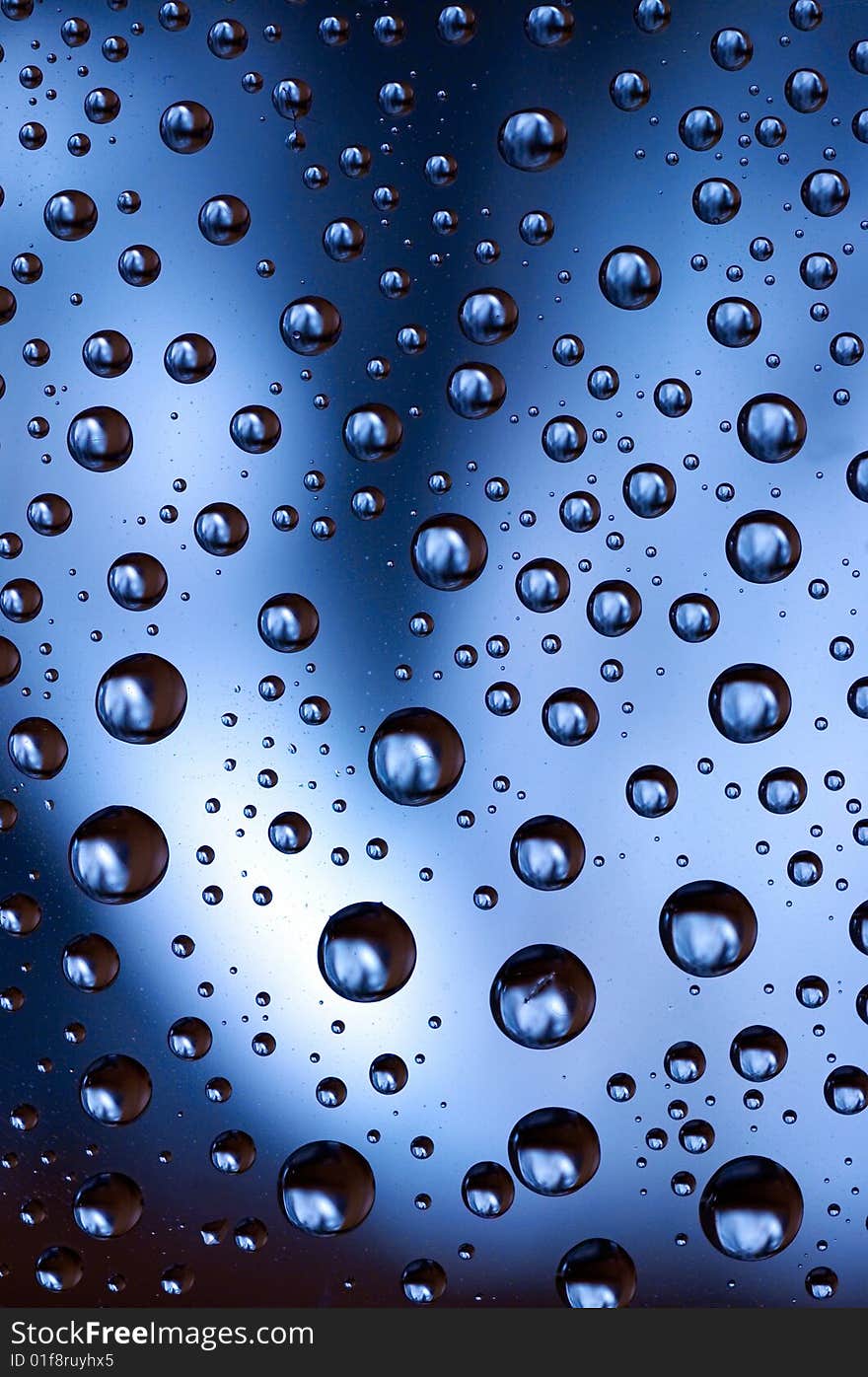 Blue water drops spots background