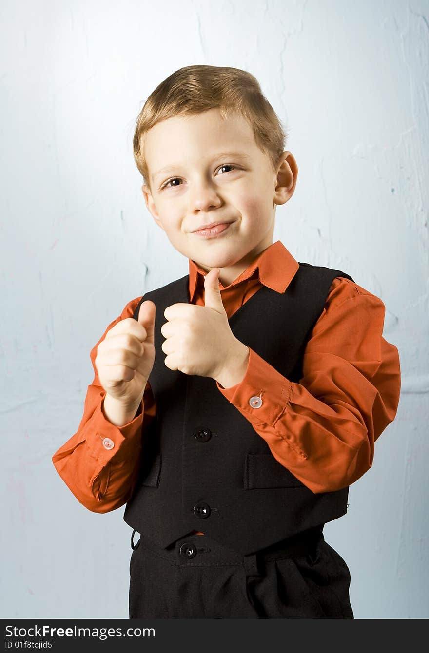 Boy making thumbs-up sign